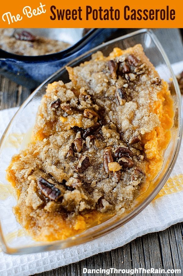 The Best Sweet Potato Casserole in a clear dish with brown sugar and pecans on top in a white dish.