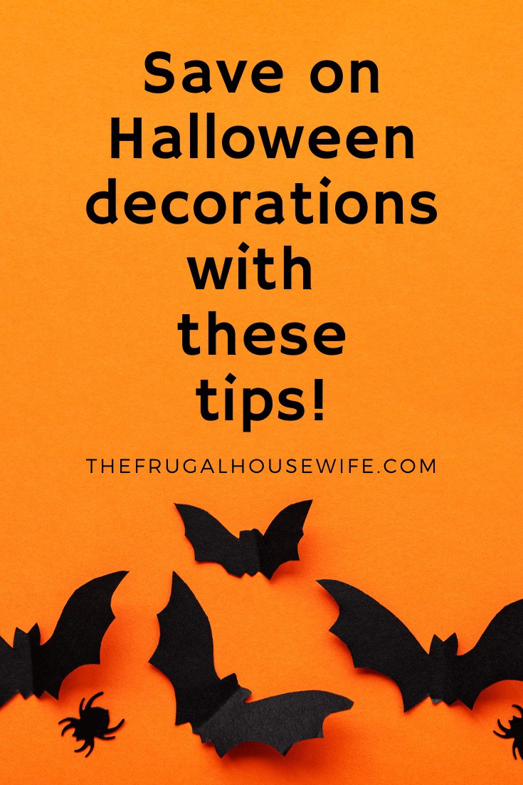 Pinterest pin with orange background and black paper spiders