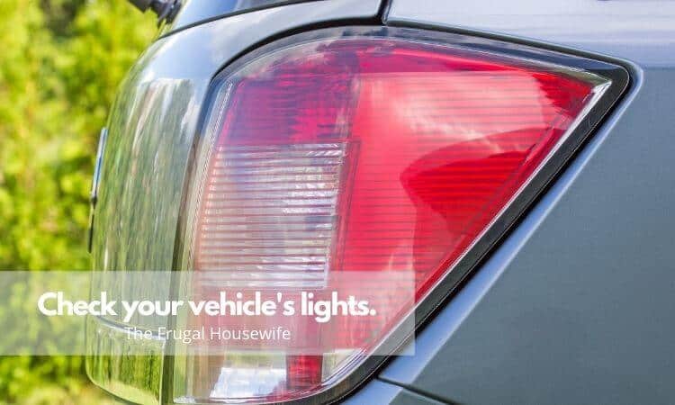Silver blue car's tail lights which is red. Used for The Frugal Housewife's Winter Car Care Tips post.
