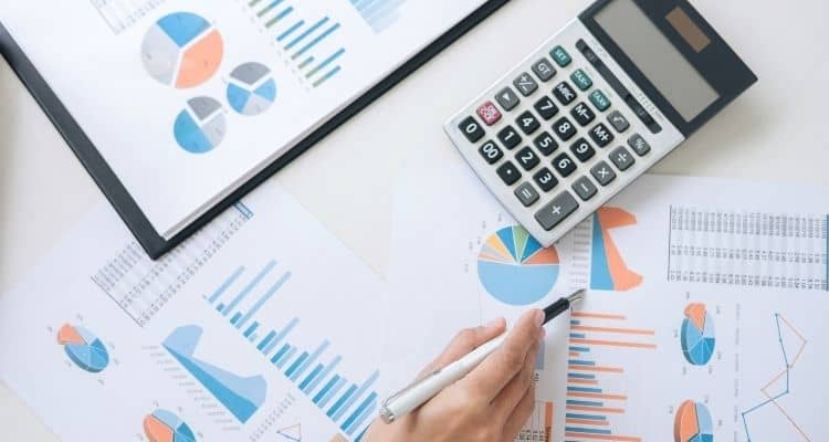 Financial papers with calculator on a table