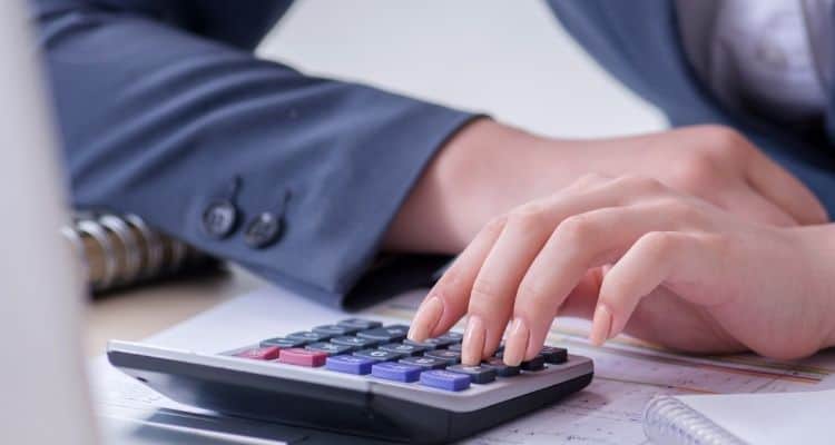 Woman using a calculator