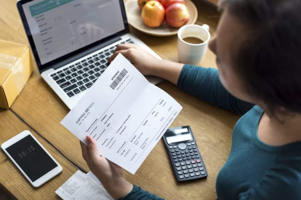 Woman paying bills on a computer.
